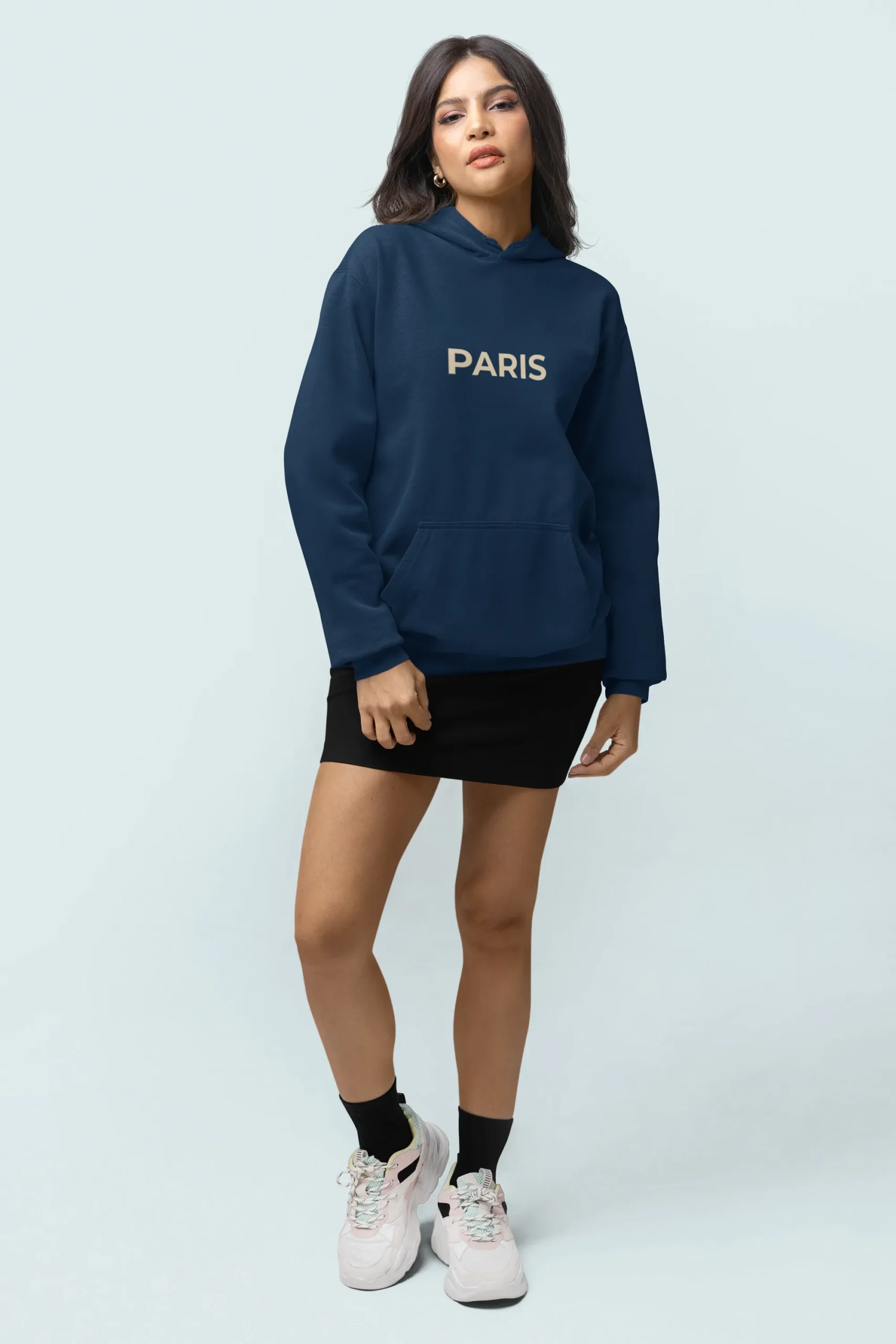 comfort-colors-mockup-of-a-woman-with-a-pullover-hoodie-and-customizable-sleeves-posing-in-a-studio-m53142