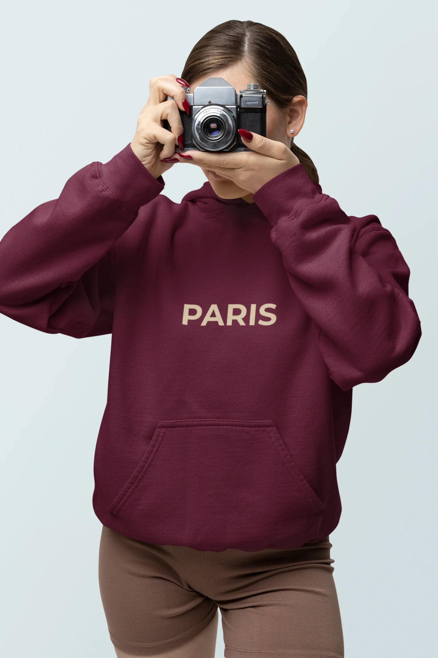 gildan-hoodie-mockup-featuring-a-woman-taking-a-photo-with-a-vintage-camera-m38556