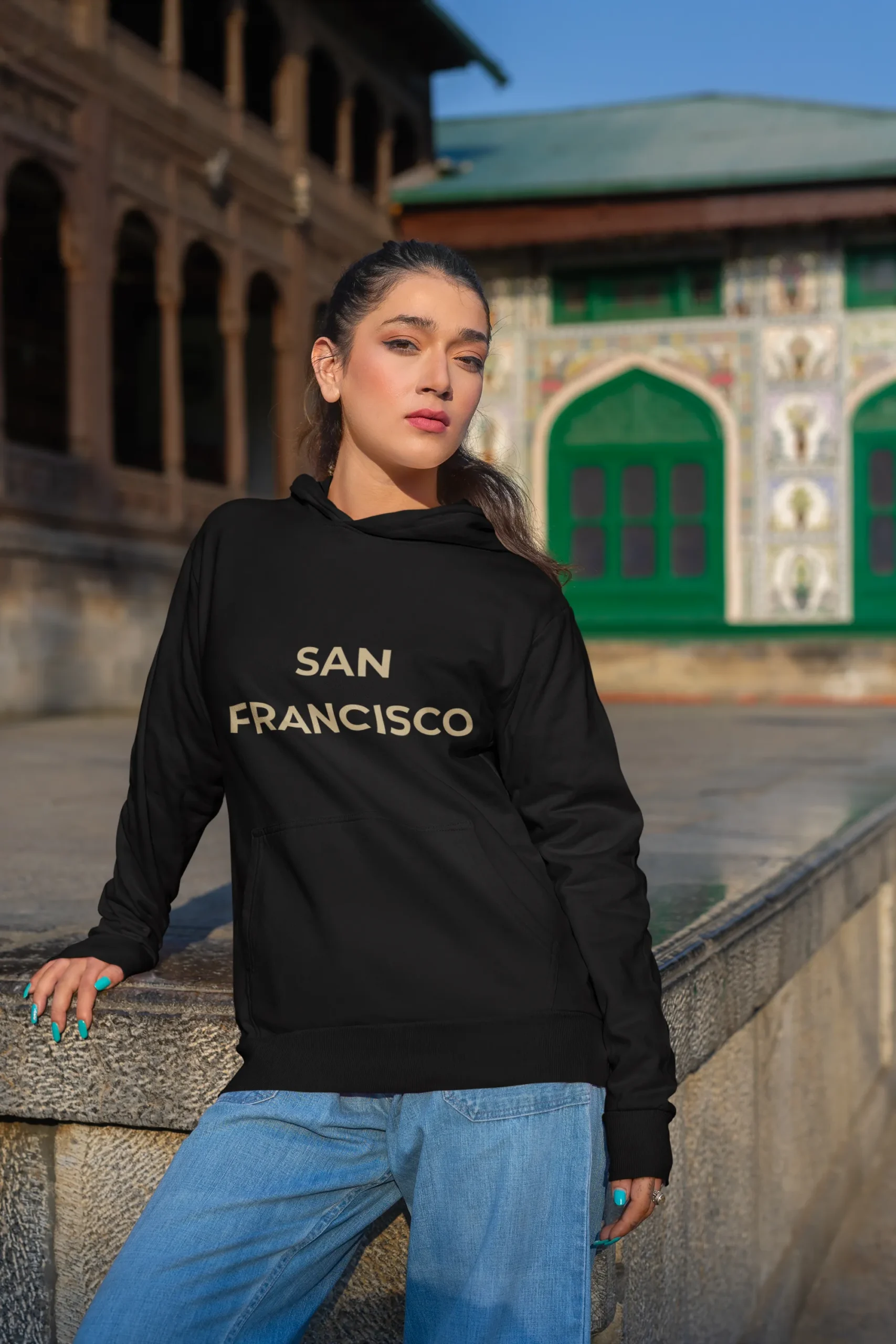 gildan-pullover-hoodie-mockup-featuring-a-woman-posing-with-a-serious-look-by-the-street-m35645