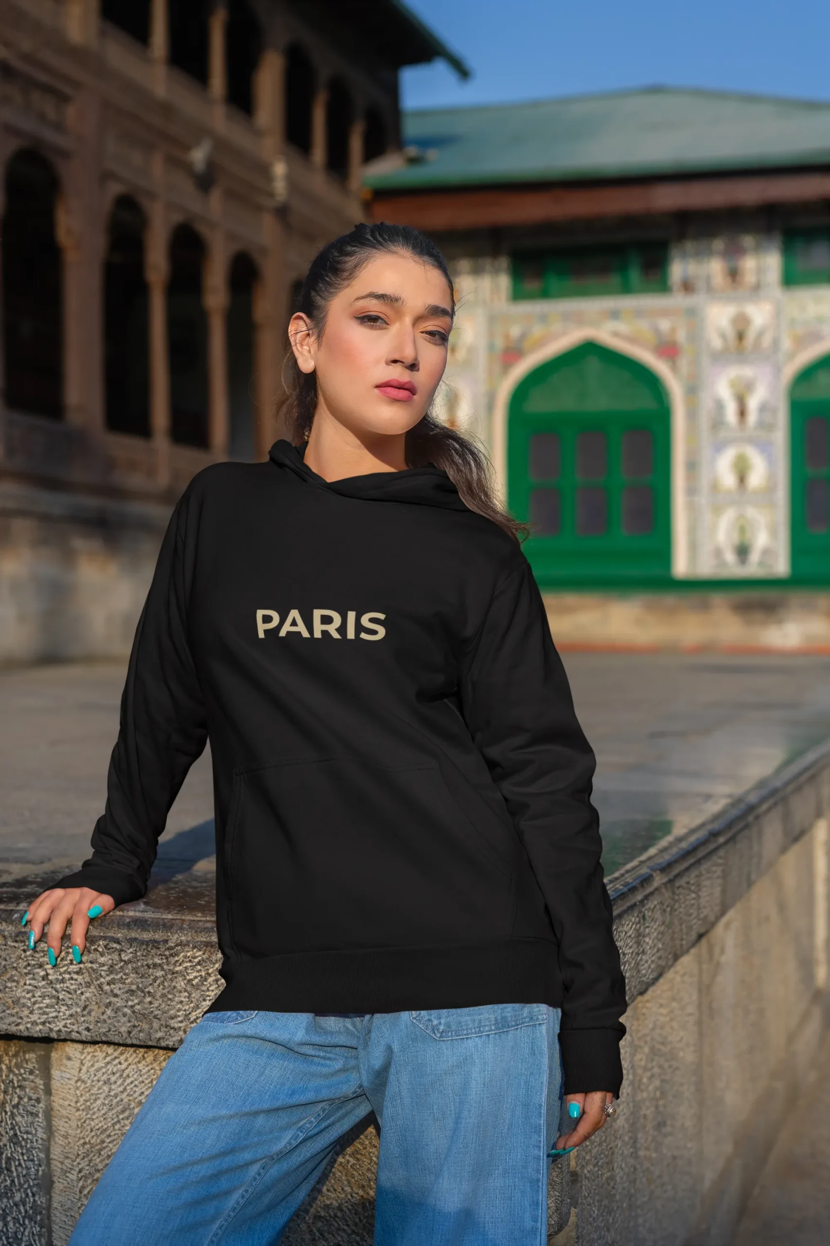 gildan-pullover-hoodie-mockup-featuring-a-woman-posing-with-a-serious-look-by-the-street-m35645